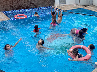 kids playing in pool with movable pool floor