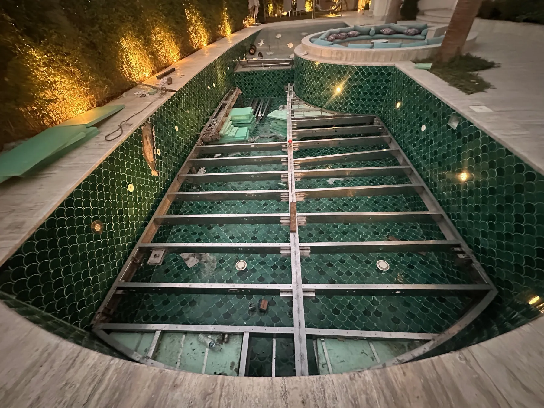 Stainless steel platform installed in a tiled Dubai pool